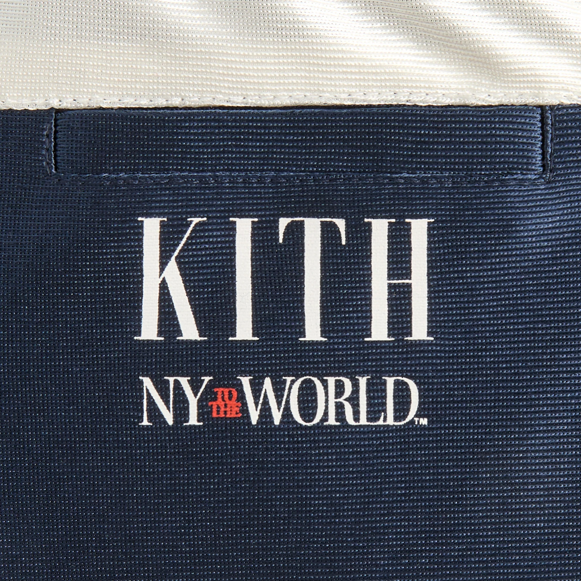 11400-kith-baby-new-york-to-the-world-faille-curtis-short-1.webp