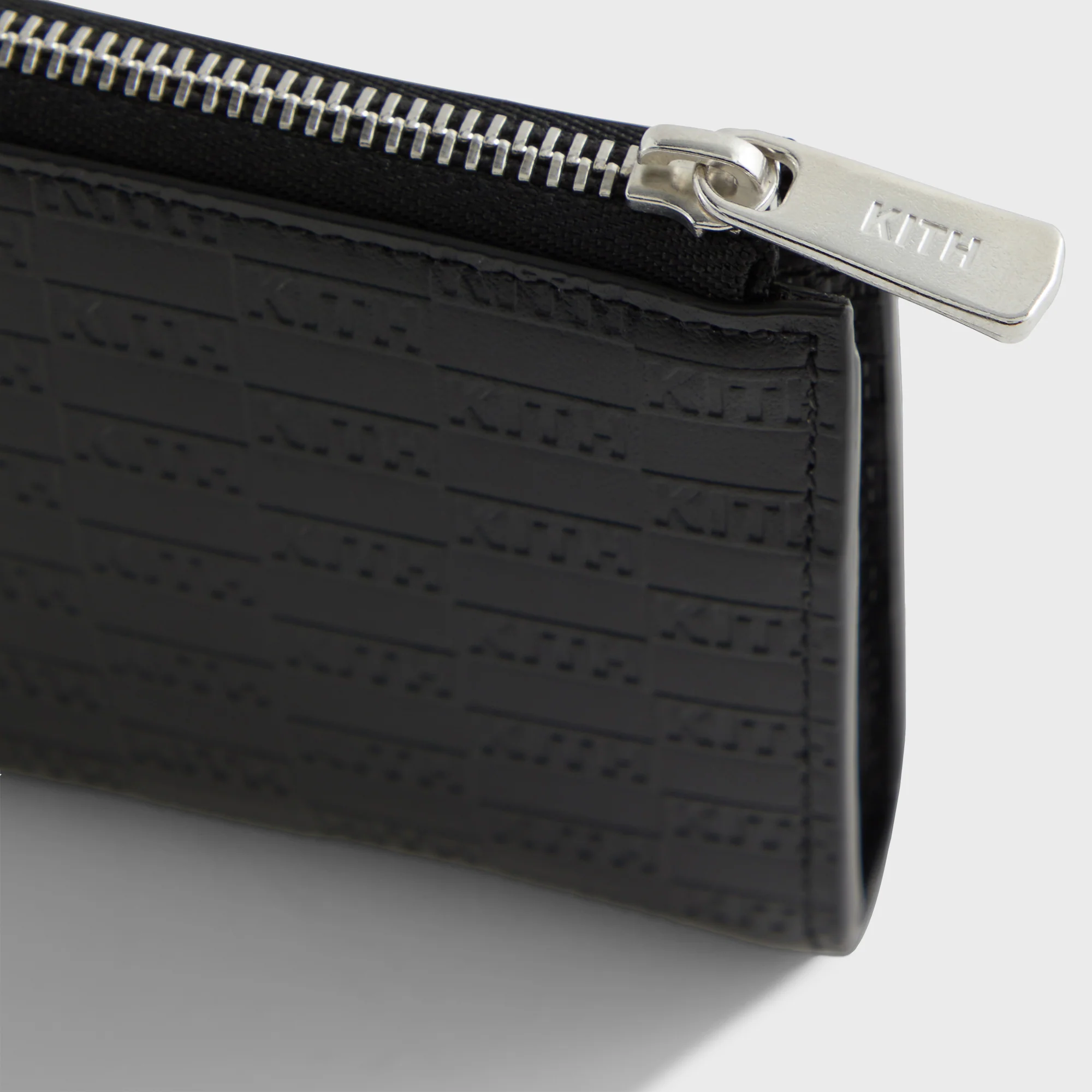 6067-kith-monogram-half-zip-wallet-1.webp