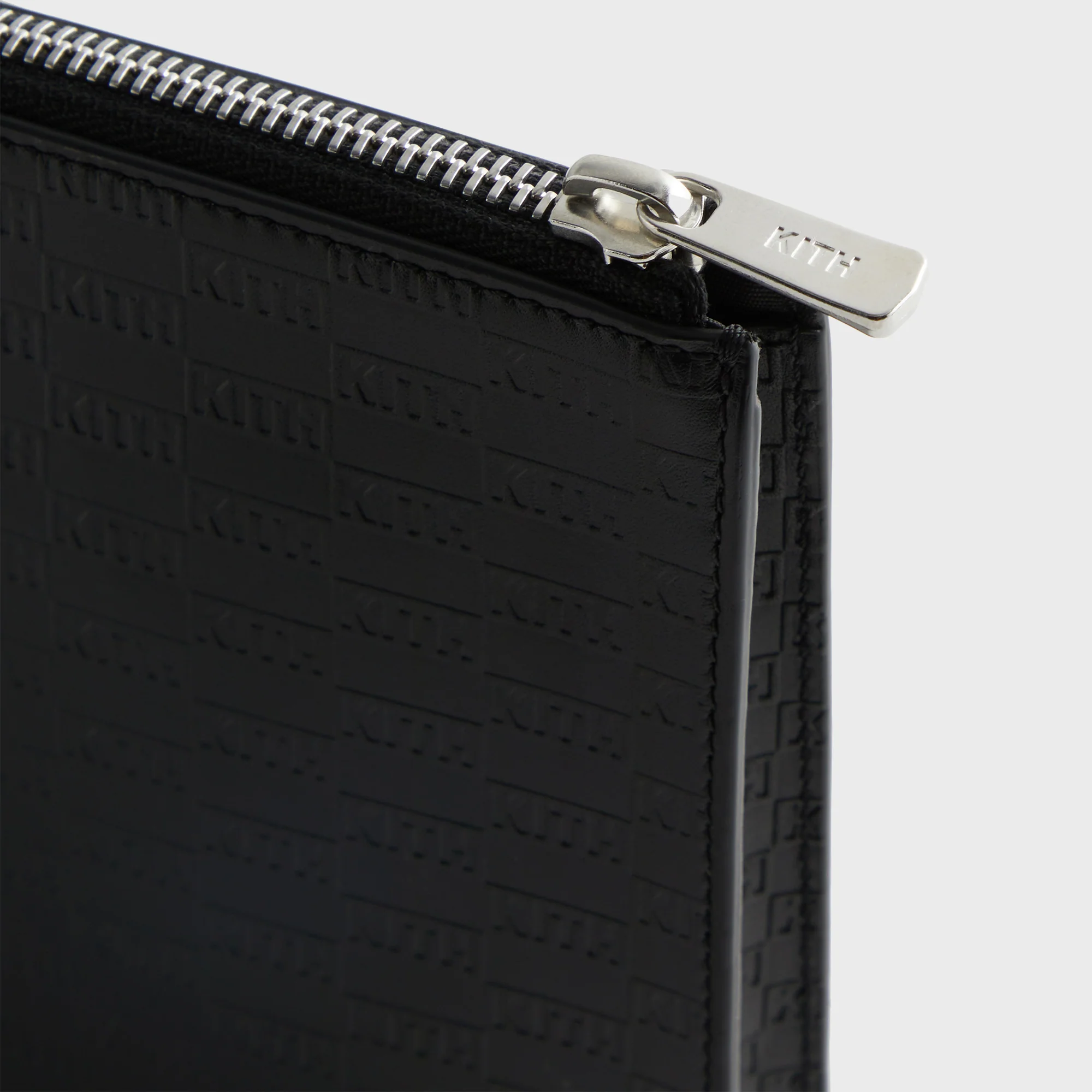 6074-kith-monogram-zipper-pouch-1.webp