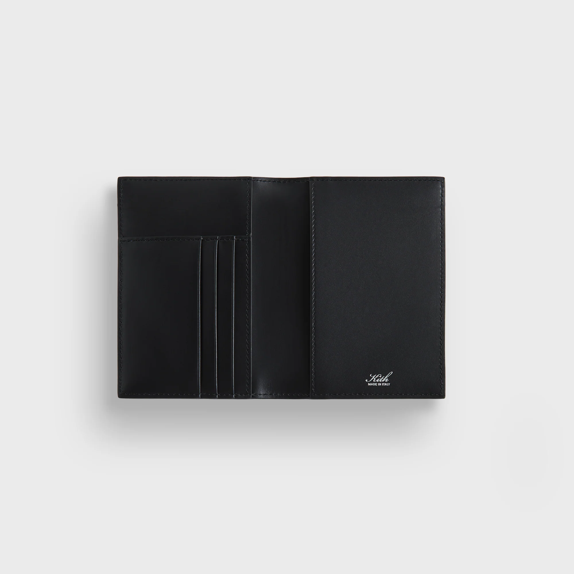 6075-kith-monogram-passport-holder-1.webp