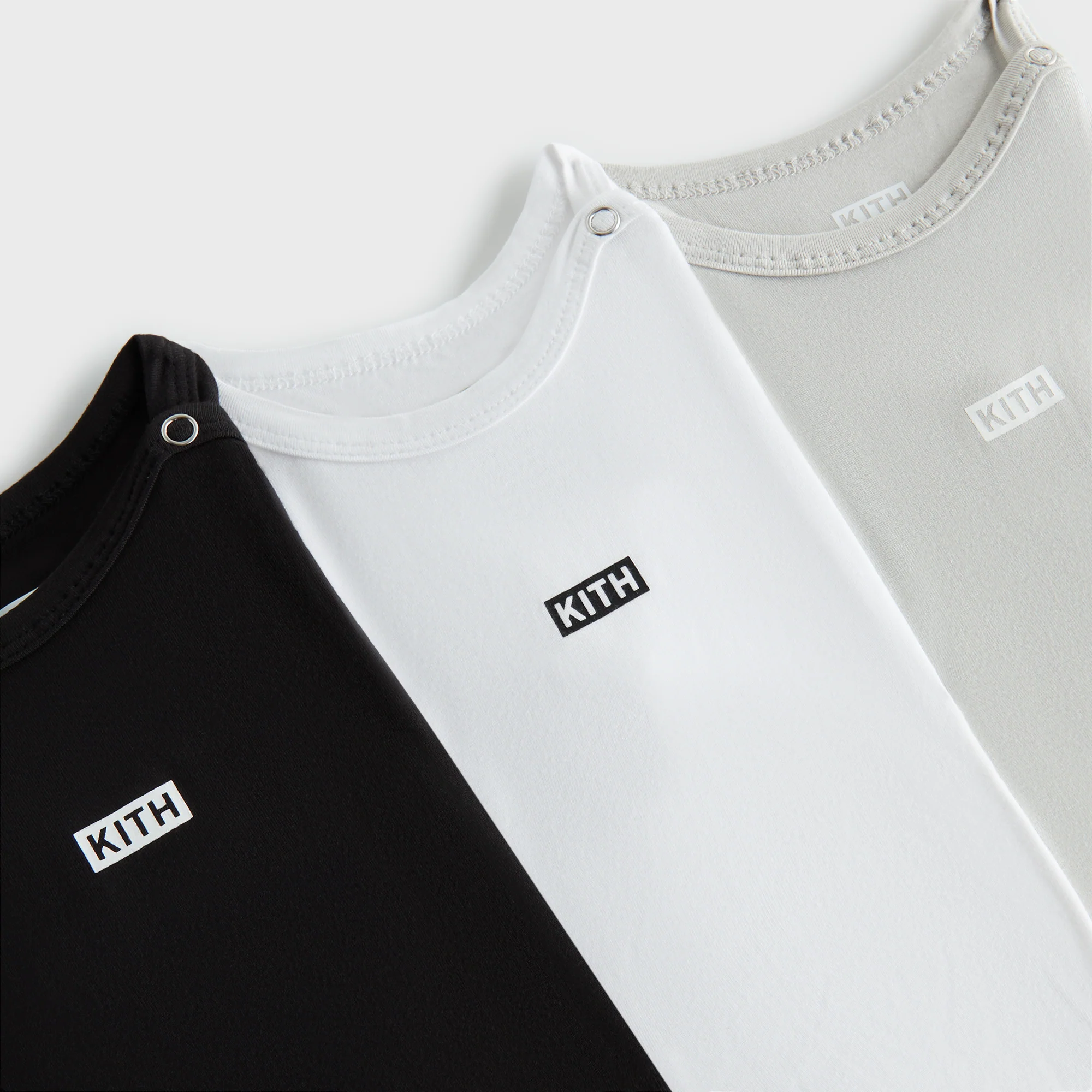 6387-kith-baby-3-pack-core-onesie-1.webp