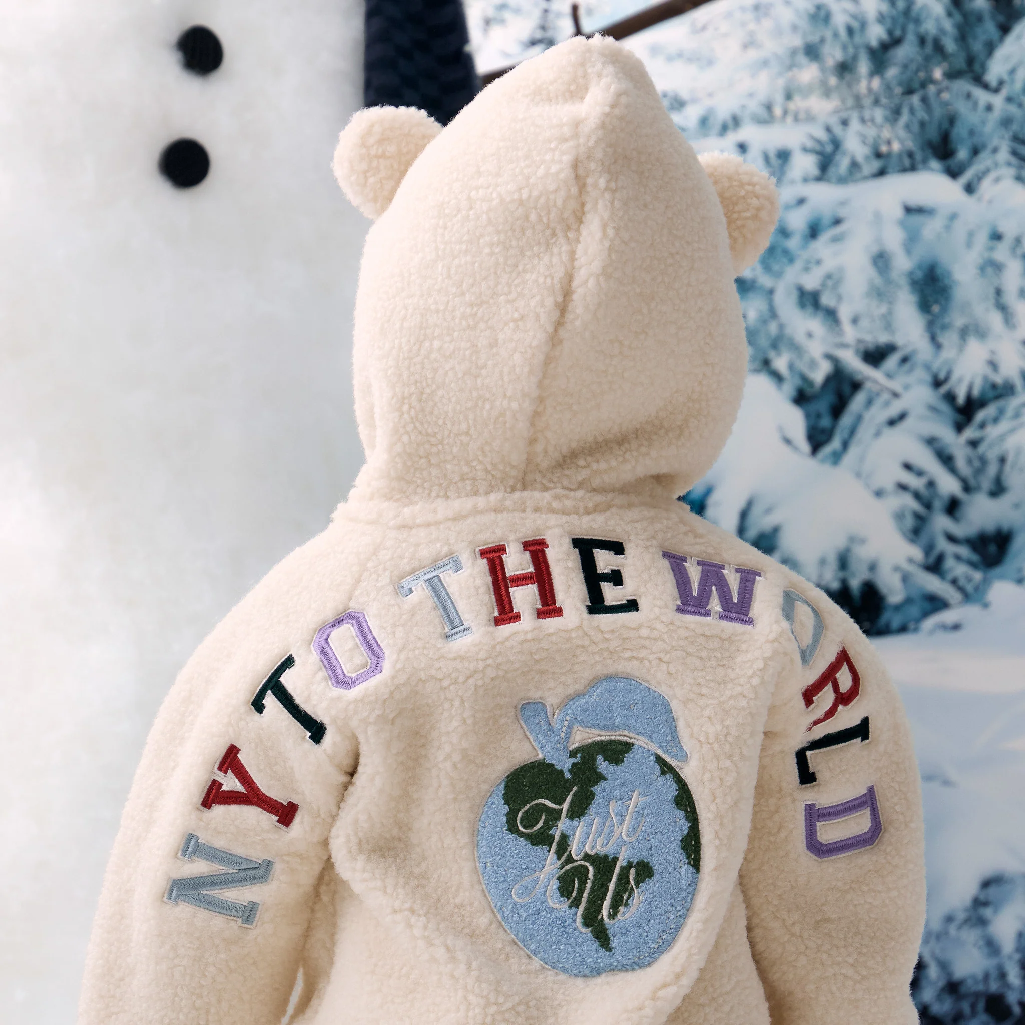 7942-kith-baby-new-york-to-the-world-sherpa-coverall-1.webp