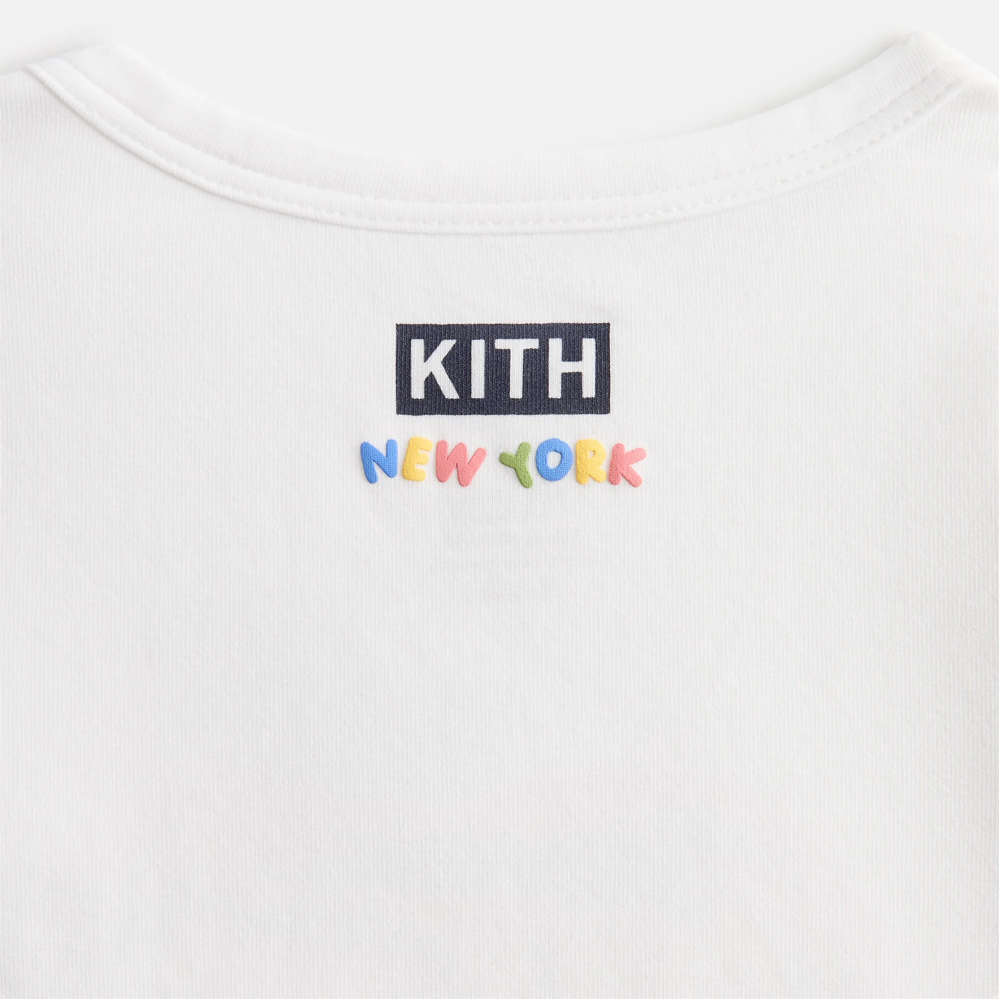 8591-kith-baby-just-us-apple-graphic-bodysuit-1.webp